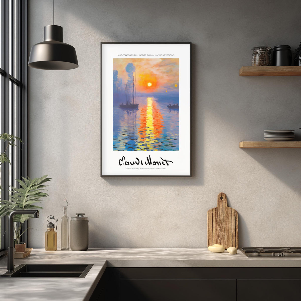 a framed painting of a sunset over a body of water, hanging on a wall above a kitchen counter with various kitchen items and decor.