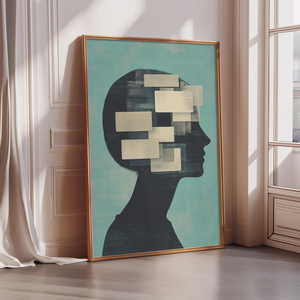 a large framed artwork depicting a silhouette of a person's head with abstract shapes or symbols superimposed on it, placed in a corner of a room with a window.