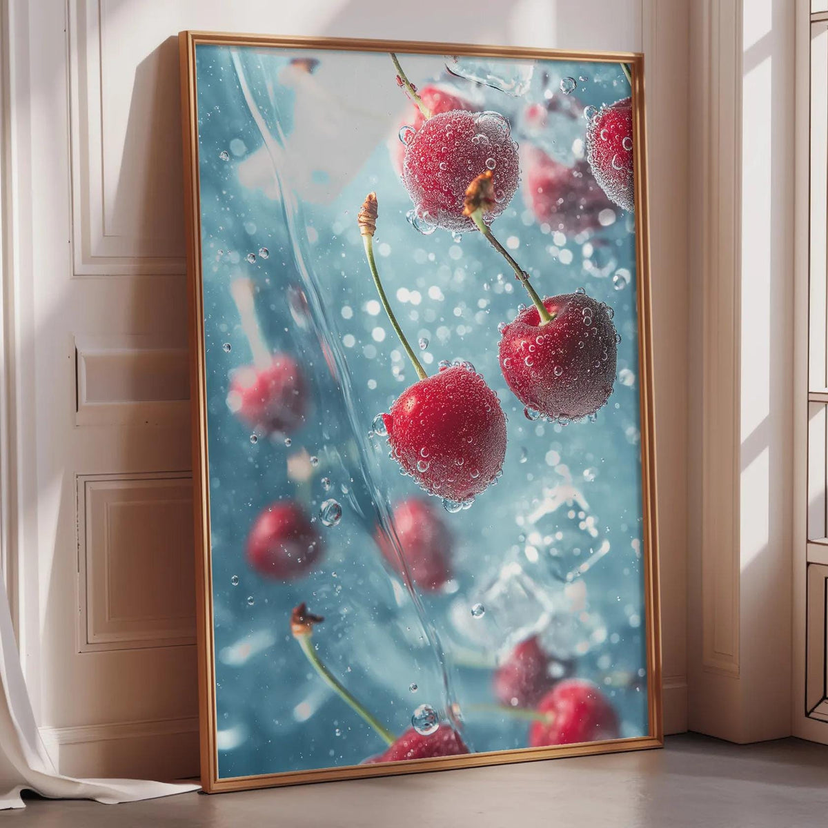 A framed photograph of cherries floating in a blue liquid, creating a visually striking and artistic composition.