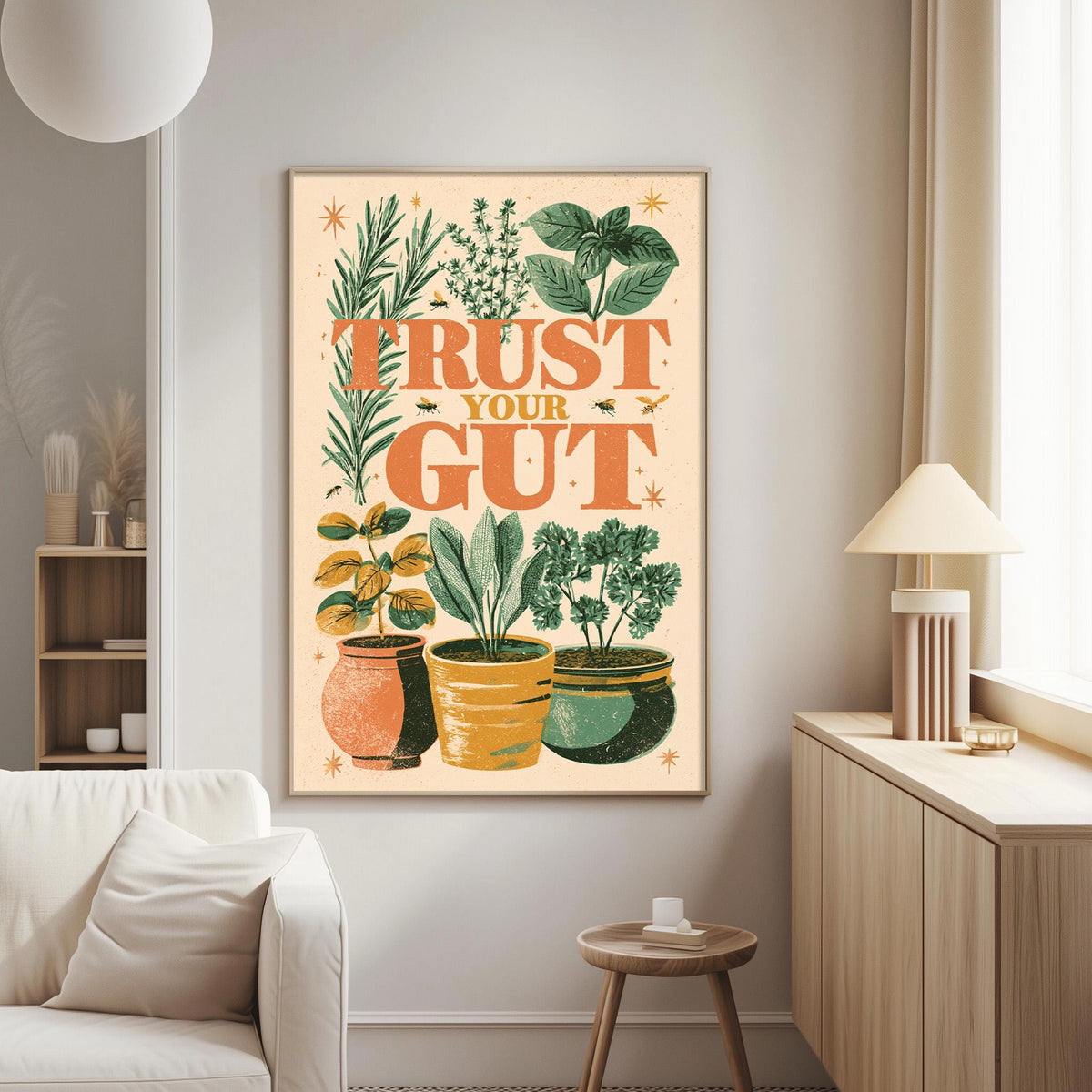 a living room with a large framed poster on the wall that says "Trust Your Gut" surrounded by various potted plants.