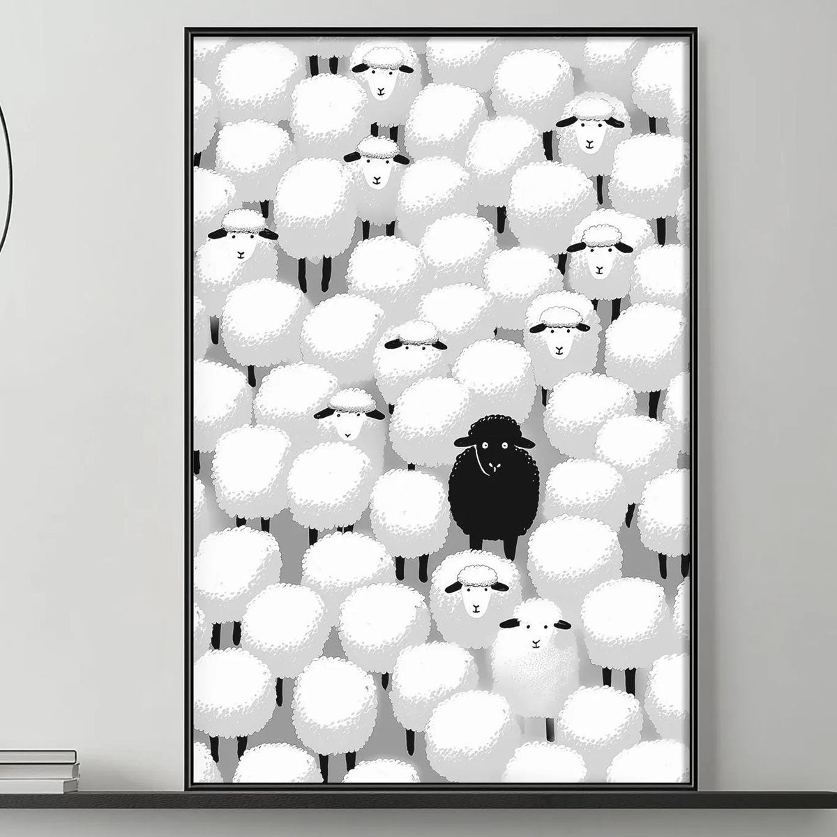a black and white living room with a gray couch, a coffee table, and a large framed artwork depicting a group of sheep with a single black sheep standing out.