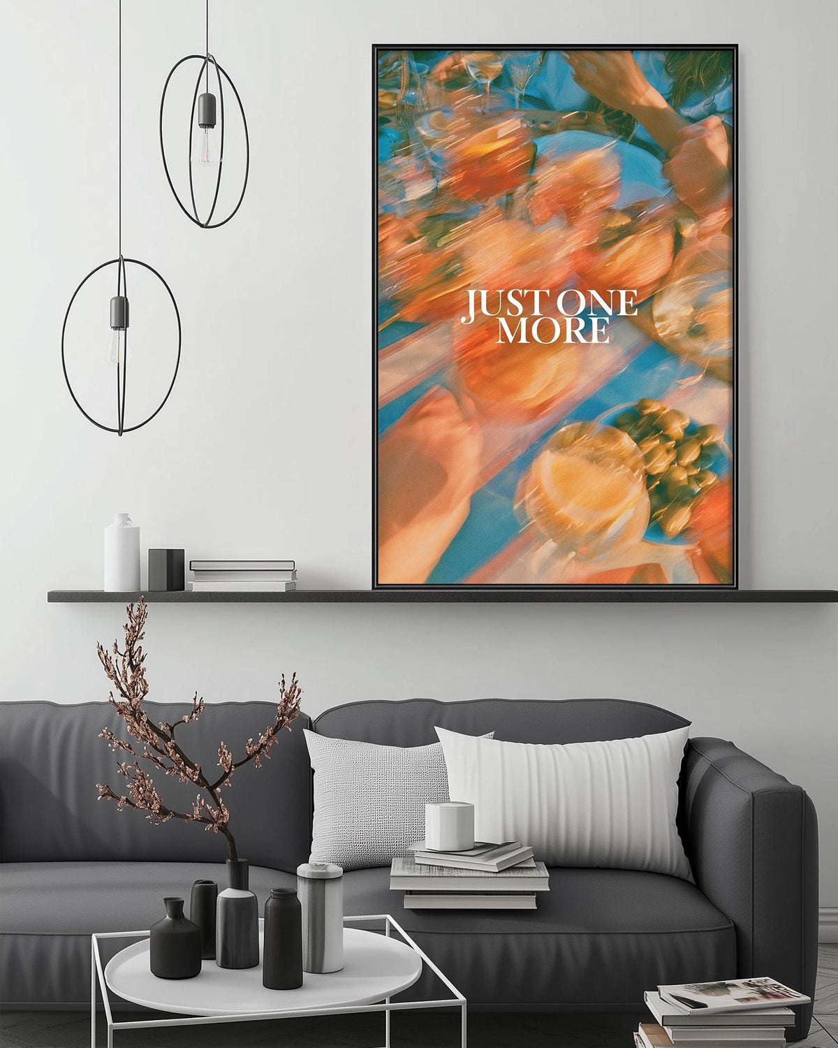 a modern living room with a gray sofa, a coffee table, and a large abstract painting hanging on the wall above the sofa.
