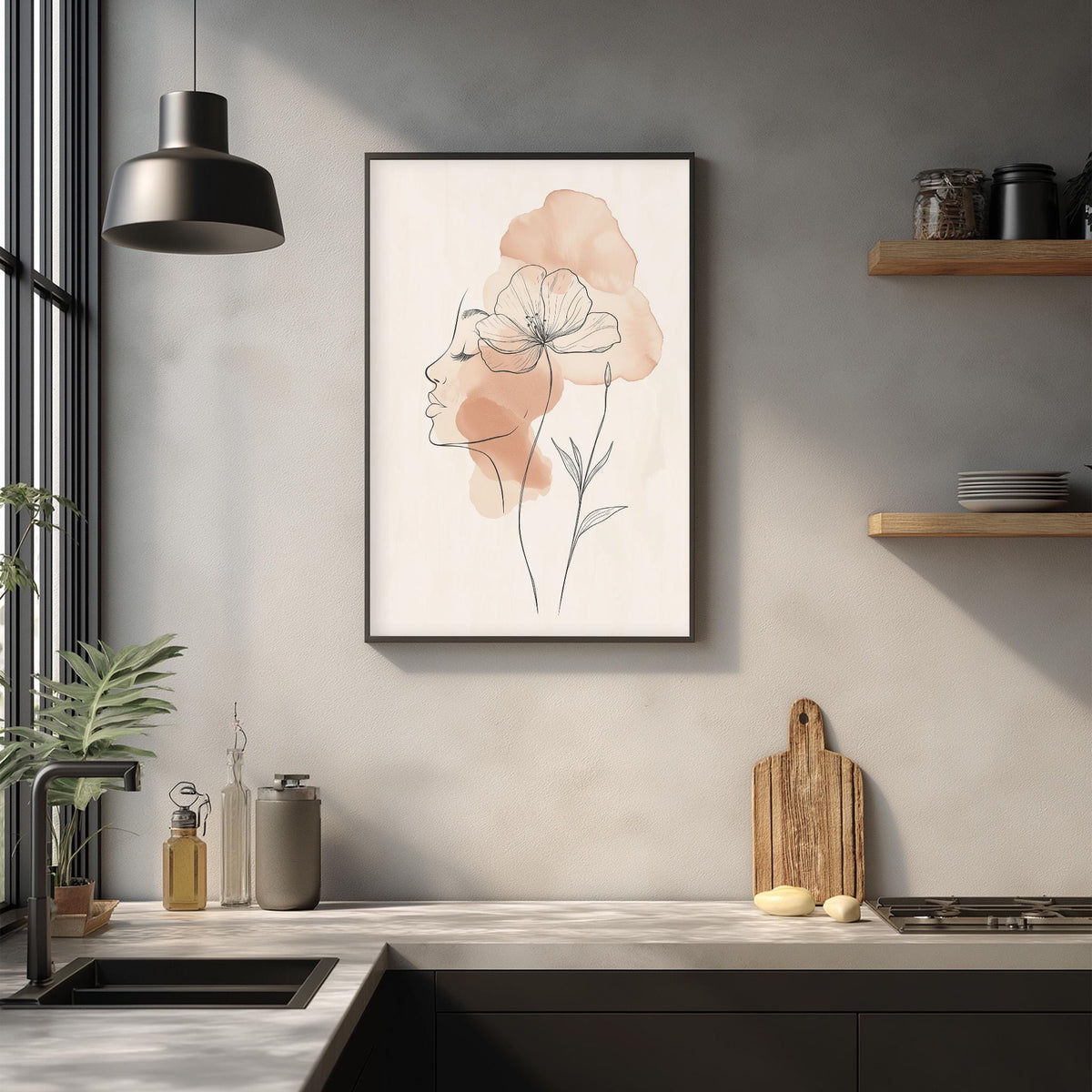 a kitchen counter with various items on it, including a framed drawing of a woman's face with a flower, a wooden cutting board, and some kitchen accessories.