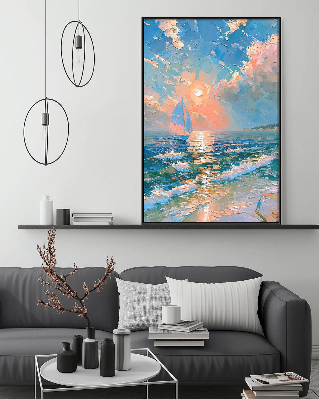 a large painting of a sailboat on the ocean, hanging on a wall above a gray couch with white pillows. The painting depicts a serene and colorful scene of the sailboat on the water, with a bright sky and a sunset in the background.