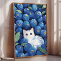A framed painting depicting a white cat surrounded by a large number of blueberries.