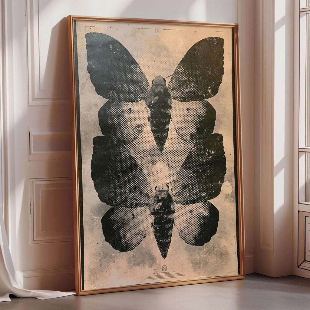 a large framed poster of a butterfly, with a black and white design.