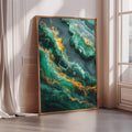 a large, framed abstract painting with a vibrant green and gold color scheme, displayed on a wall in a room with a window.