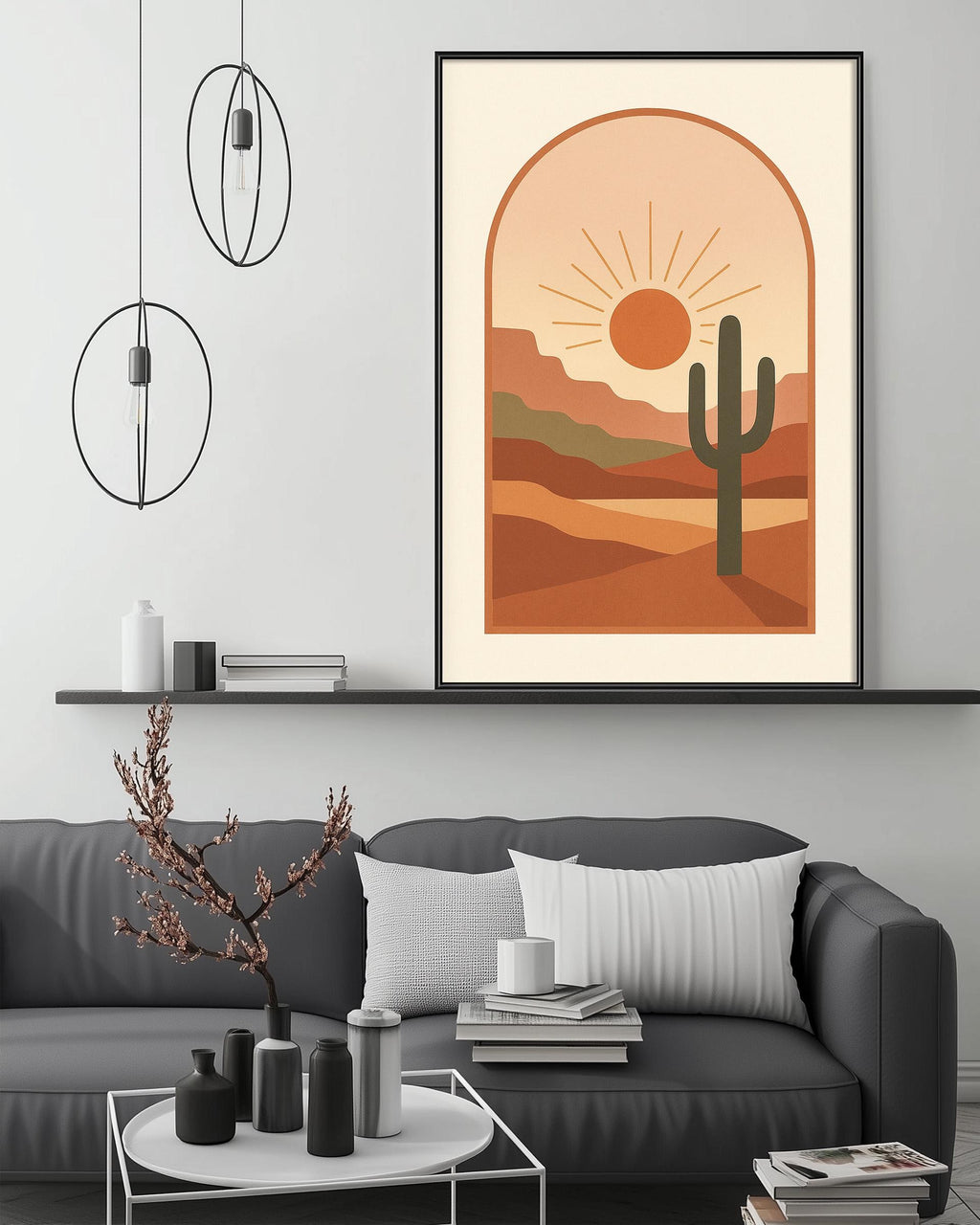 a modern living room with a gray sofa, a coffee table, and a framed desert landscape print hanging on the wall above the sofa.