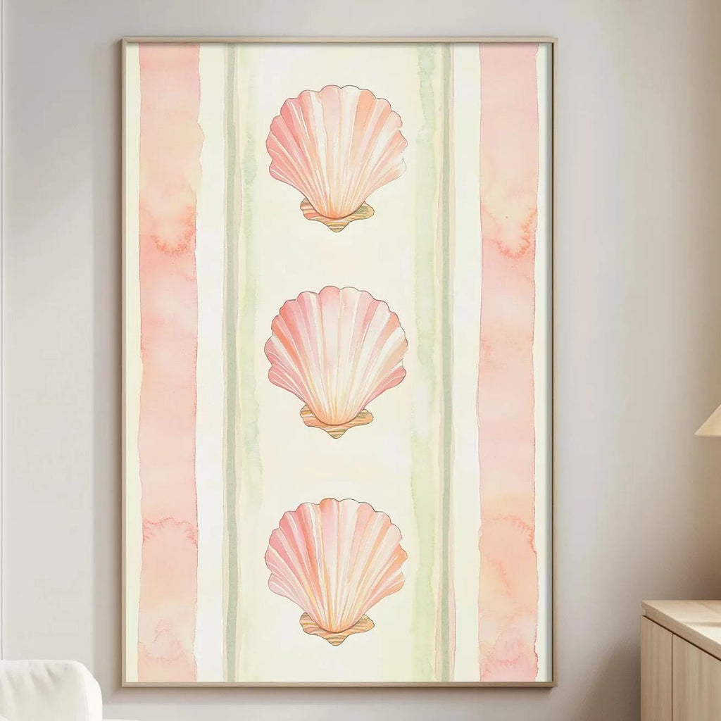 a living room with a white sofa, a wooden side table, and a framed artwork of three pink seashells on the wall.