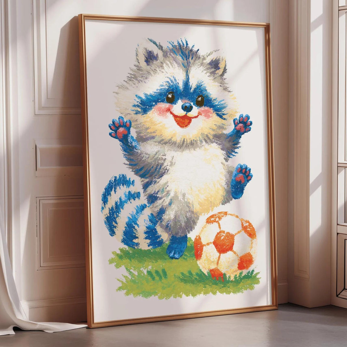 A framed cross-stitch image depicting a raccoon with a soccer ball in front of it, set against a white wall.