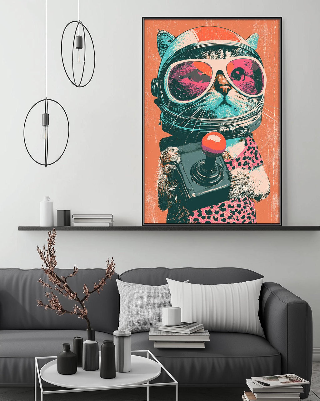 a large, colorful painting of a cat wearing a spacesuit and holding a camera, hanging on a wall above a gray couch in a living room setting.