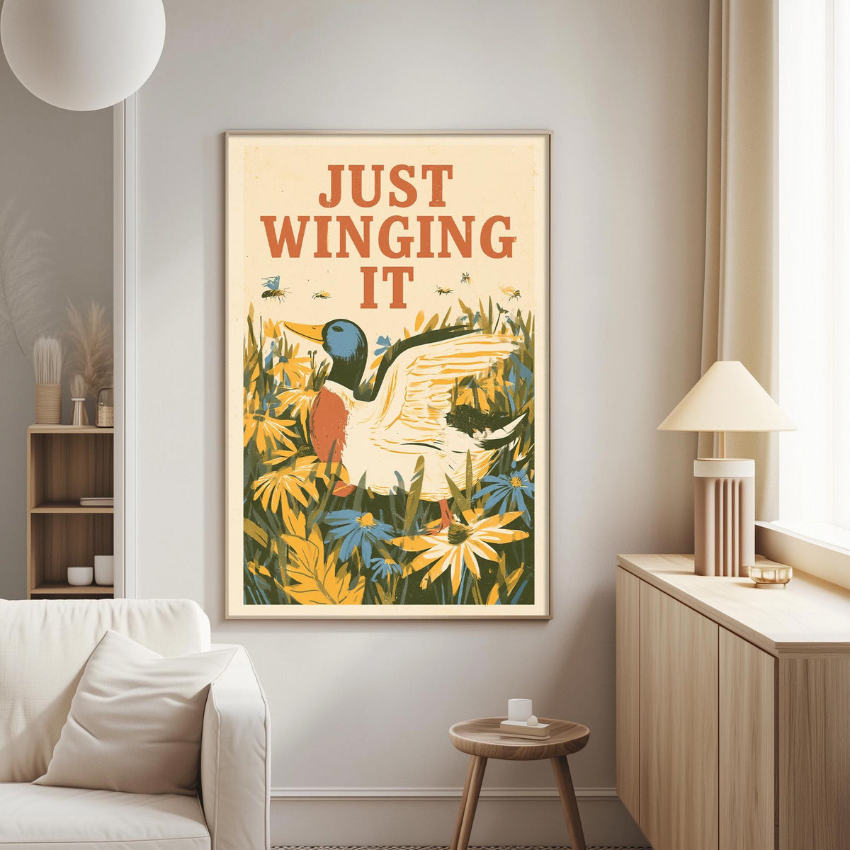 a framed poster with a duck and flowers hanging on a wall in a living room.