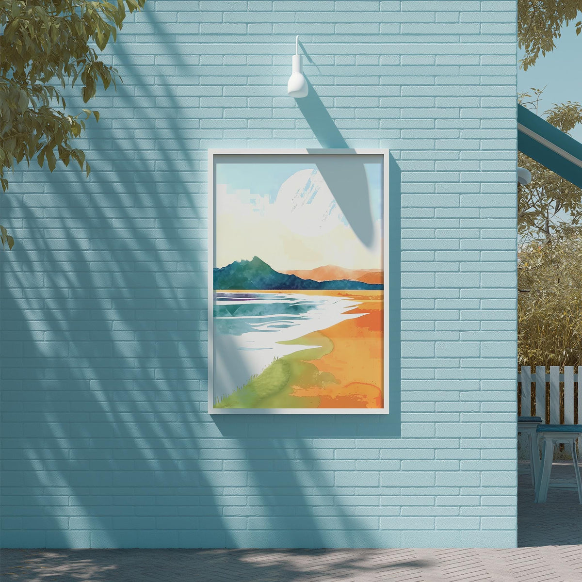 a blue brick wall with a framed painting of a beach scene hanging on it.
