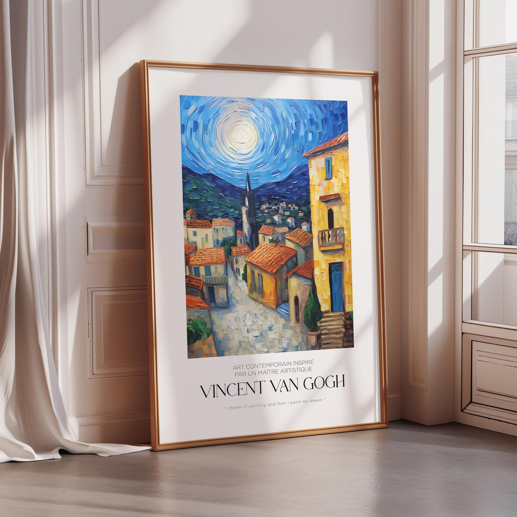 a framed painting of a village scene with a large sun in the sky, depicting a vibrant and colorful landscape.
