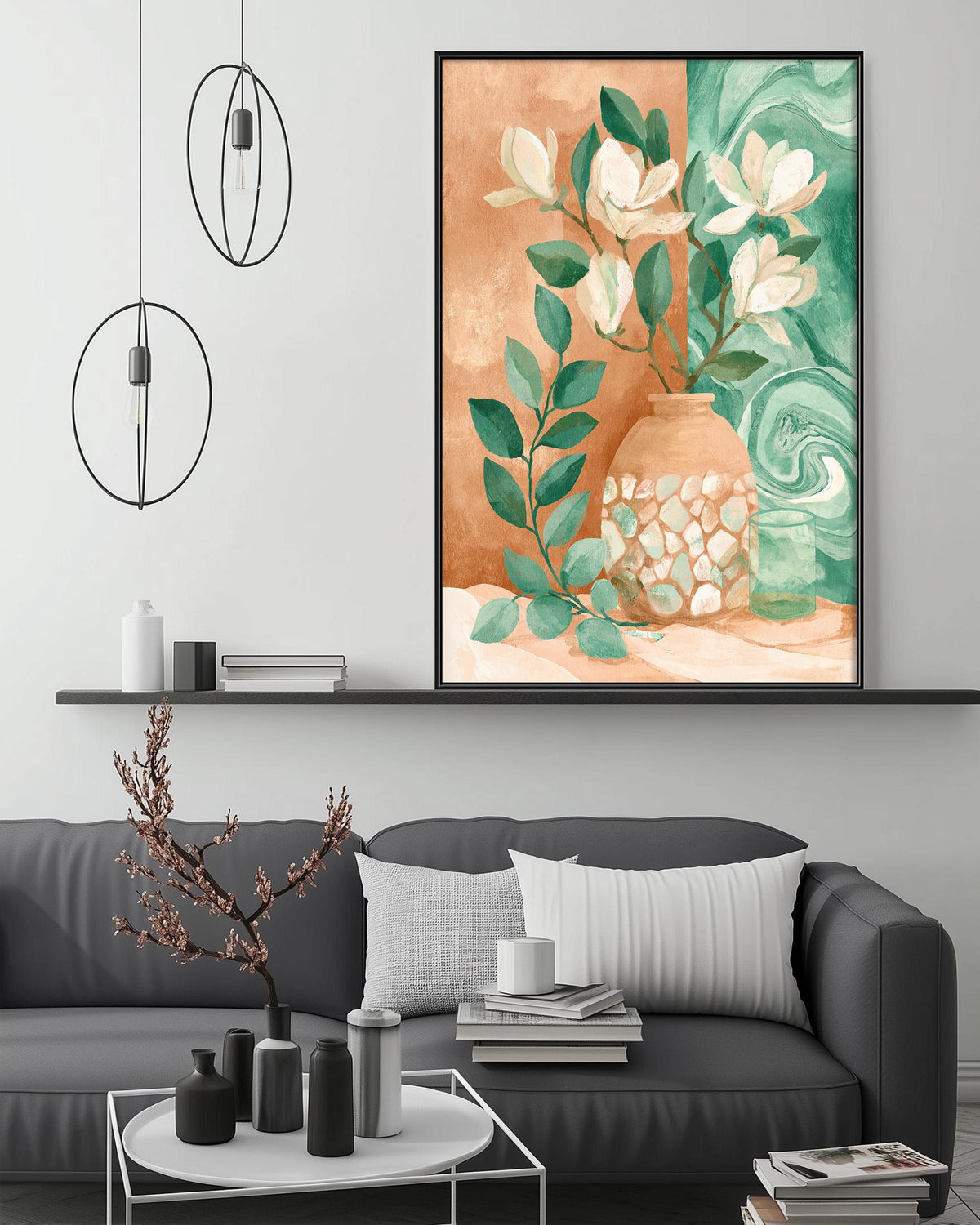 a modern living room with a gray sofa, a coffee table, and a large framed painting of a vase with flowers and leaves hanging on the wall above the sofa.