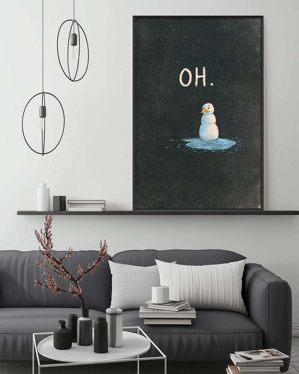 a cozy living room with a gray couch, a coffee table, and a framed artwork depicting a snowman. The artwork has the word "OH" written above it.