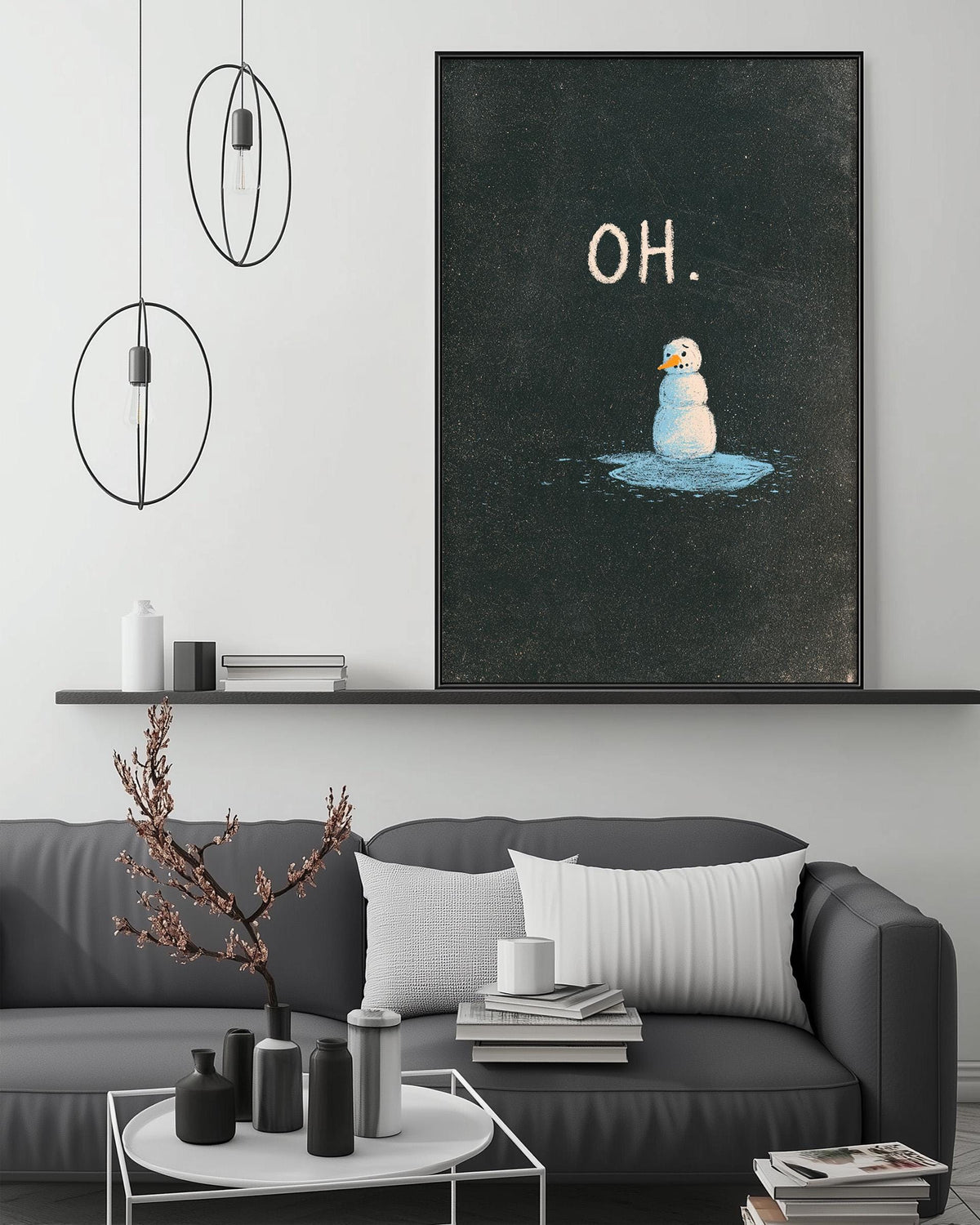 a cozy living room with a gray couch, a coffee table, and a framed artwork depicting a snowman. The artwork has the word "OH" written above it.