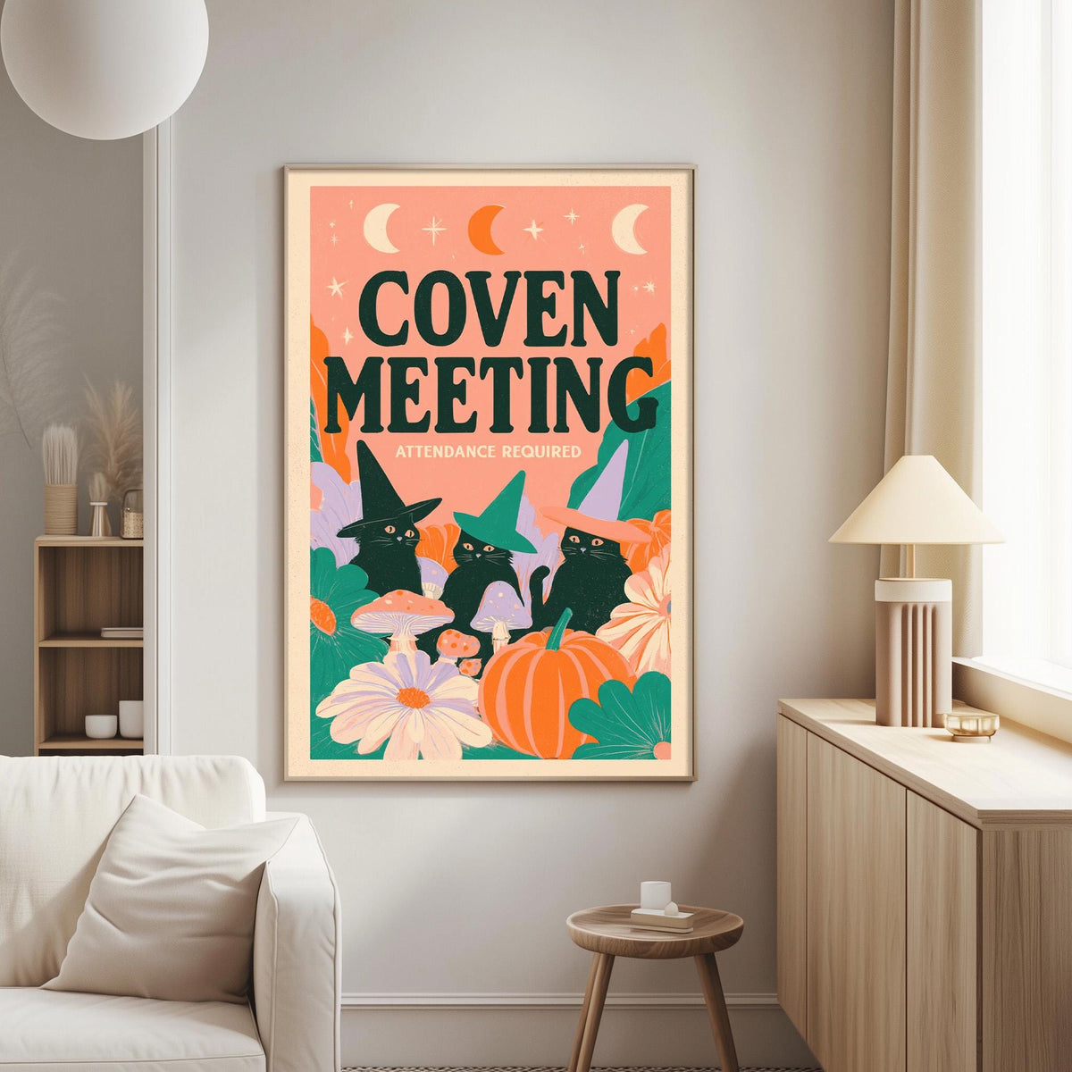 a poster with a whimsical illustration of cats and mushrooms, along with the text "COVEN MEMBER" and "ATTENDANCE REQUIRED" displayed prominently.