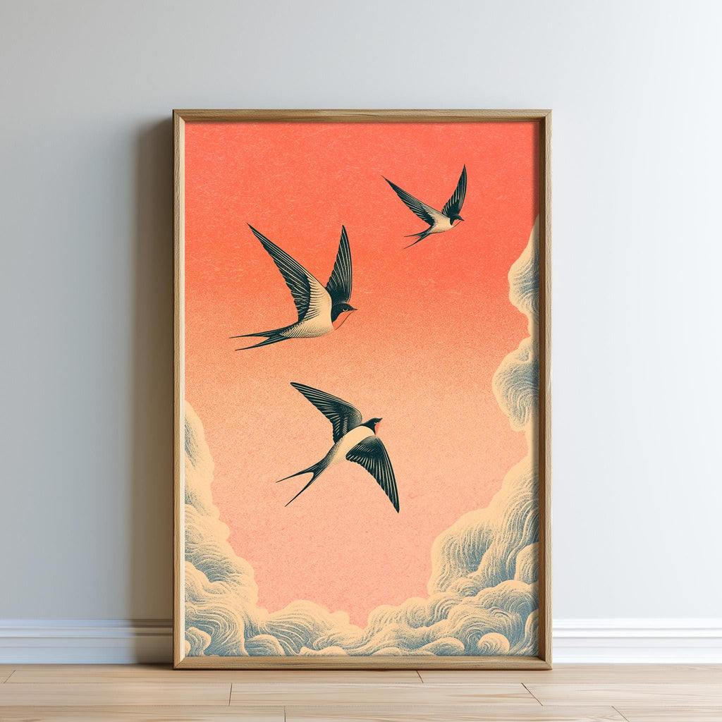 A framed illustration of three birds in flight against a vibrant orange and pink sky.