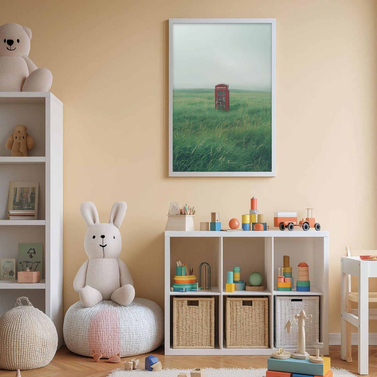 A cozy children's room with a white rabbit sitting on a bean bag chair, surrounded by toys and a bookshelf. A framed picture of a red telephone booth in a field is displayed on the wall above the bookshelf.