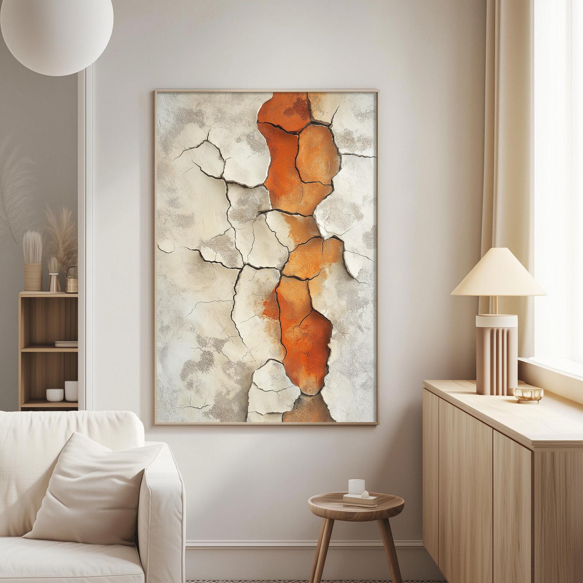 a living room with a large abstract painting hanging on the wall, a white sofa, a wooden side table, and a lamp on a wooden cabinet.