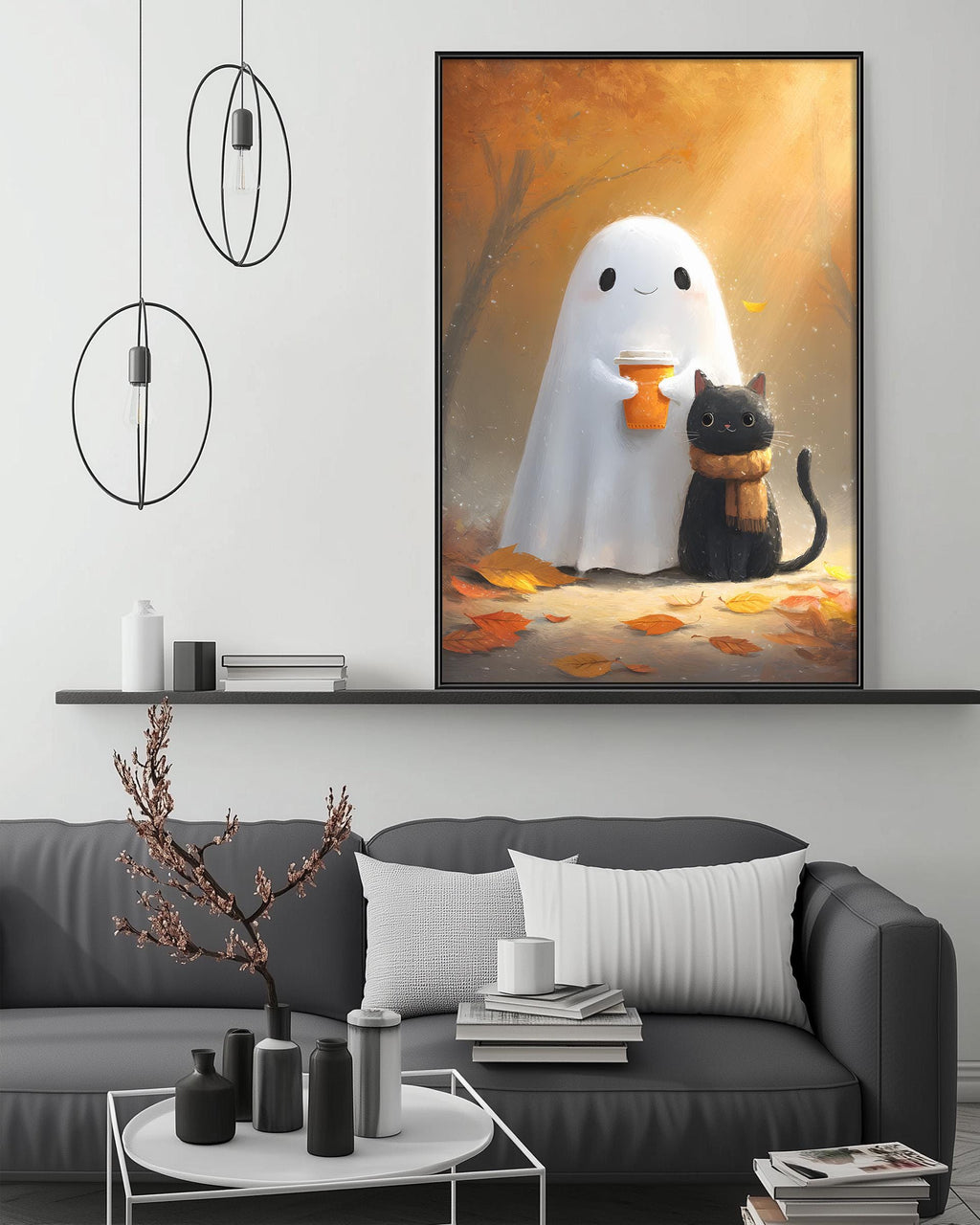 a cozy living room with a gray couch, a coffee table, and a framed artwork depicting a ghost and a cat.
