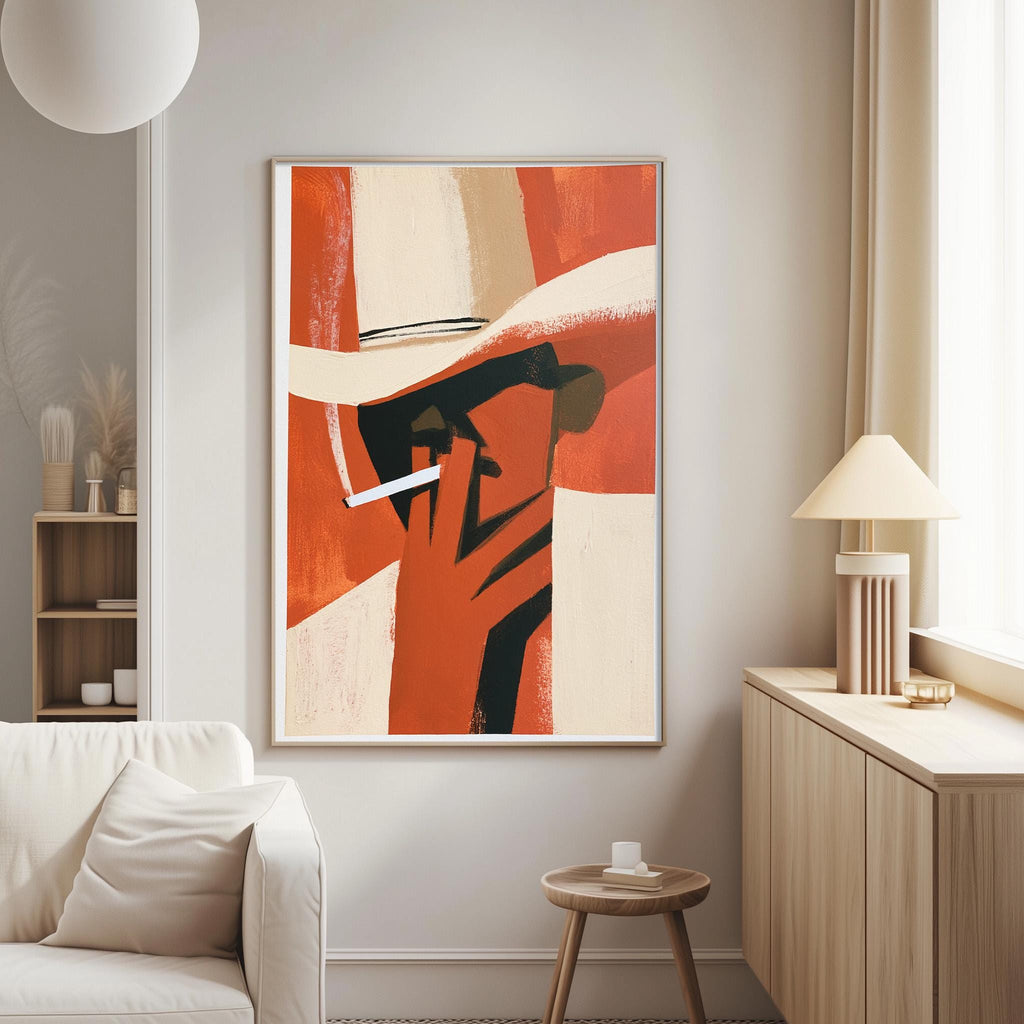 a modern living room with a large abstract painting of a man's face hanging on the wall. The painting has a bold red and orange color scheme, with a white hat and a cigarette in the man's hand. The room is furnished with a white sofa, a wooden side table, and a lamp, creating a cozy and stylish atmosphere.