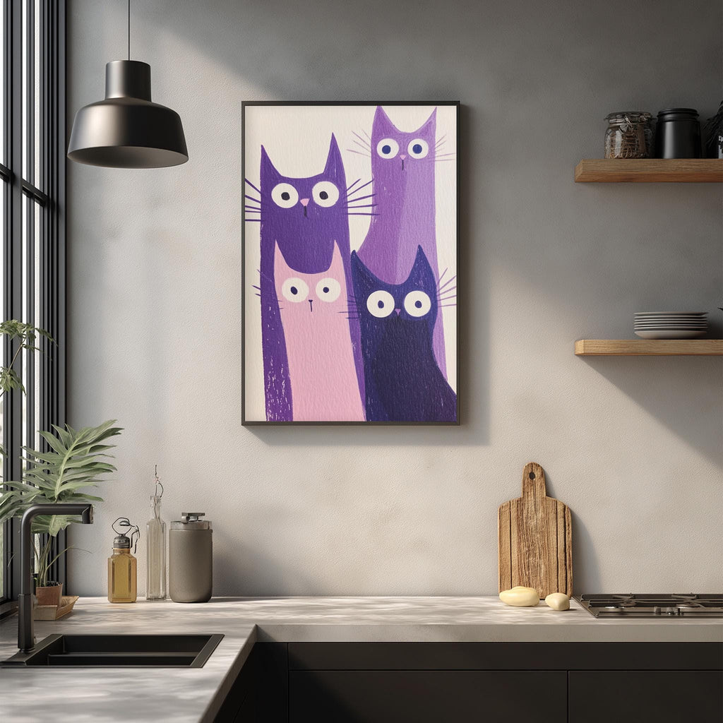 a kitchen counter with a framed picture of three cats in purple and pink colors, along with a wooden cutting board and some kitchen accessories.