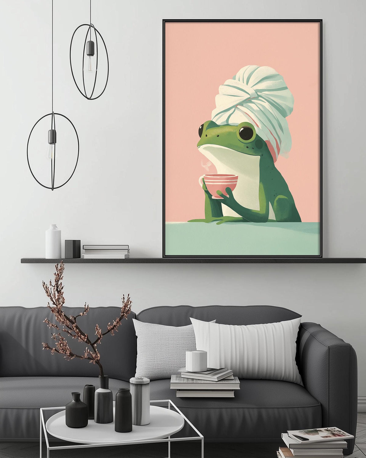 a cozy living room with a gray couch, a coffee table, and a framed illustration of a frog wearing a white towel and holding a pink bowl.