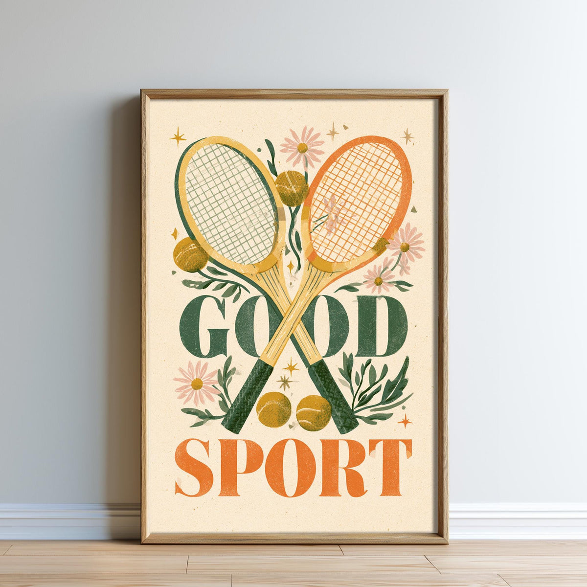 The image is a framed poster with a tennis racket and flowers, along with the text "GOOD SPORT" prominently displayed.