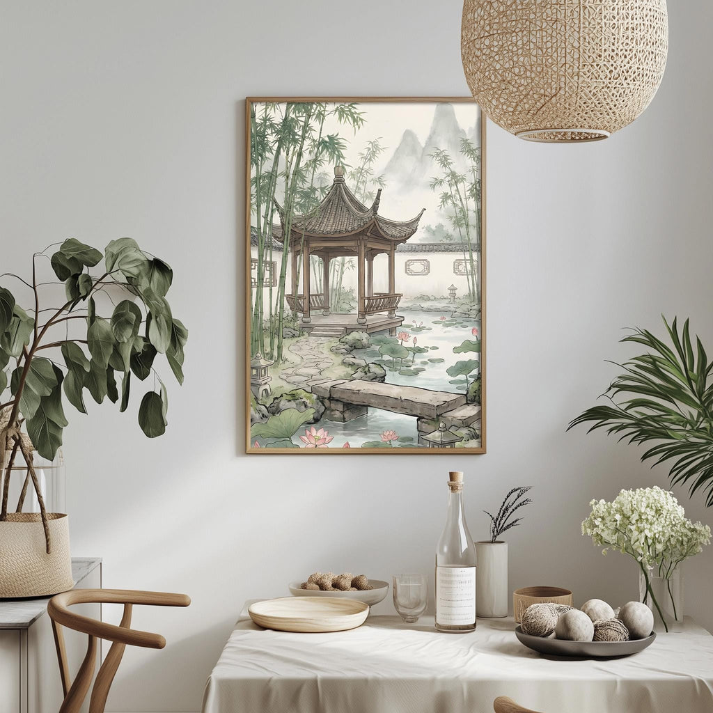 a serene oriental garden scene with a pagoda, bamboo trees, and a pond, all framed and hung on a wall. The table is set with a vase of white flowers, a bottle, and a bowl of fruit, creating a peaceful and inviting atmosphere.