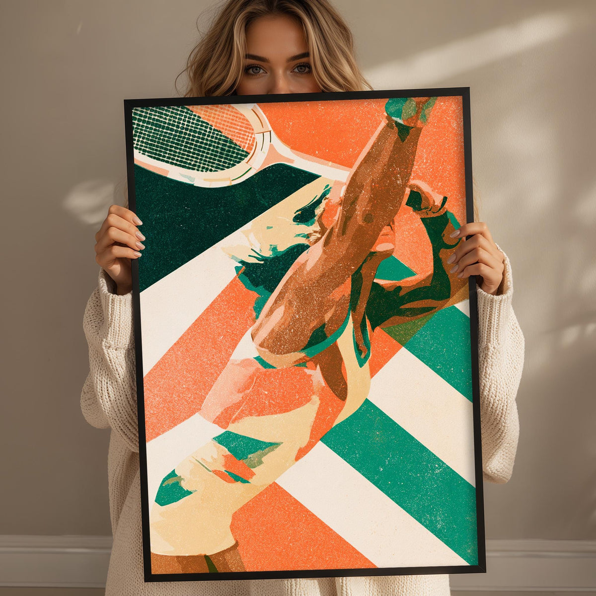 A woman holding a framed print of a tennis player in action, with a colorful abstract background.