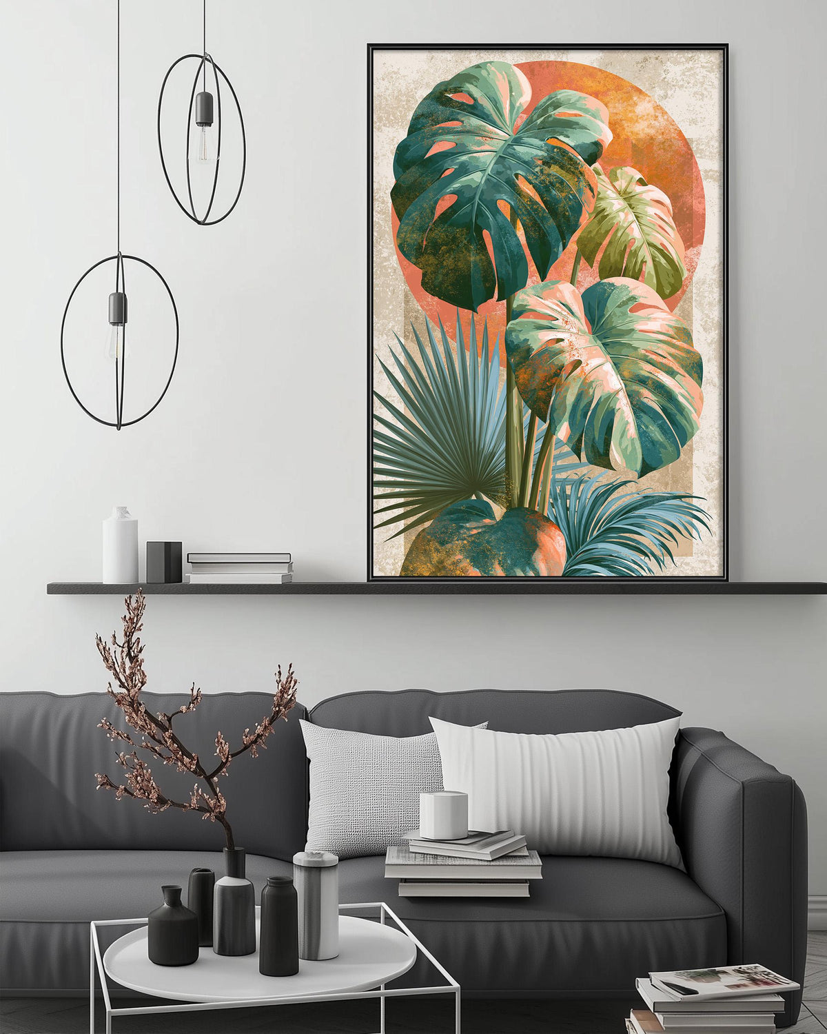 a modern living room with a gray sofa, a coffee table, and a large framed print of tropical plants hanging on the wall above the sofa.