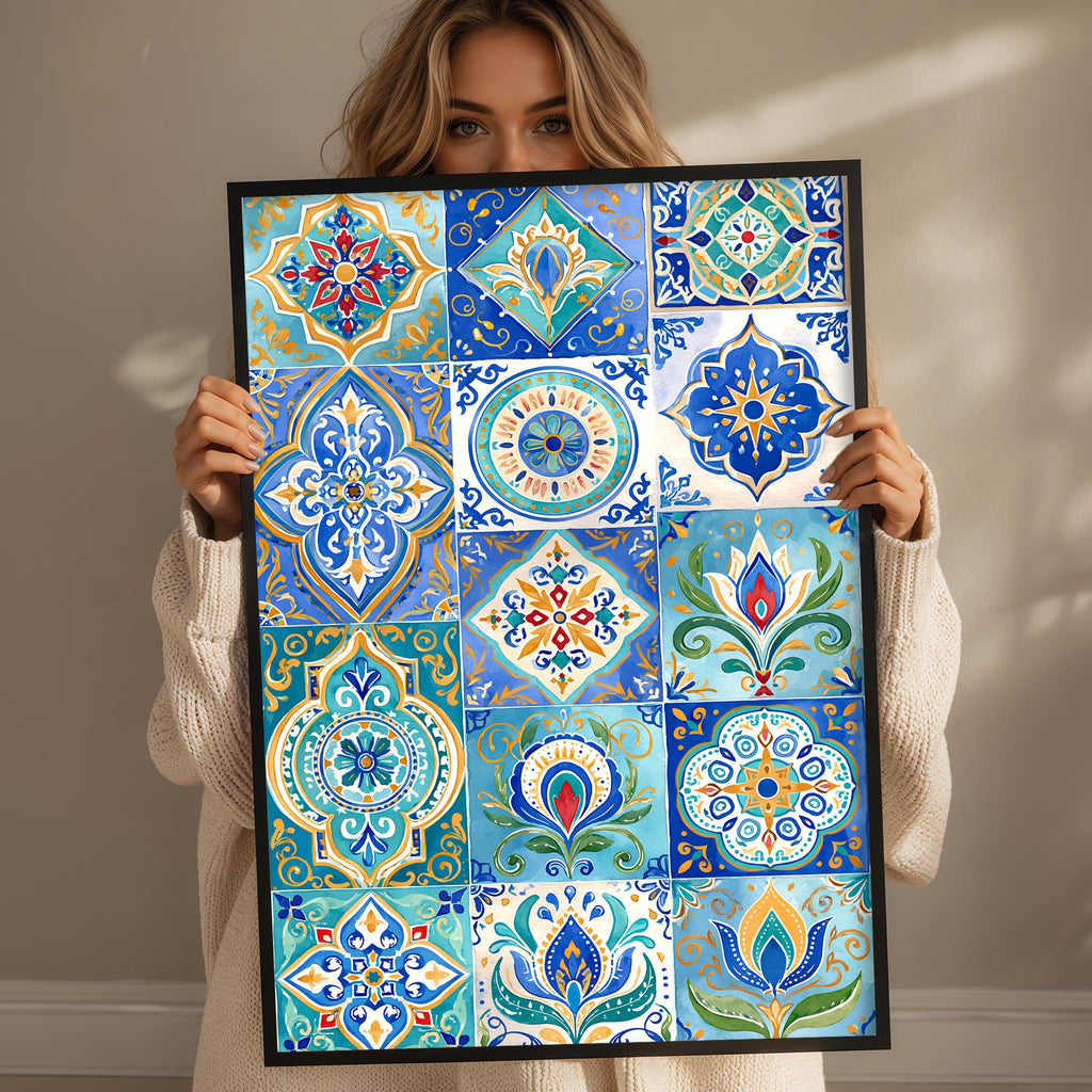 A woman is holding up a framed collage of colorful, intricate tile designs.