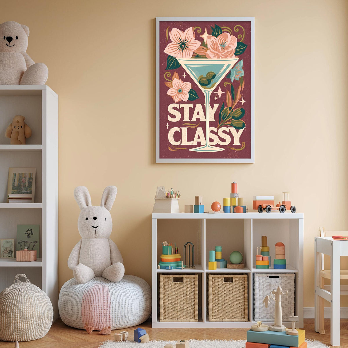 A child's bedroom with a large poster of a cocktail glass and flowers on the wall, a stuffed rabbit, a bookshelf, and a toy train.