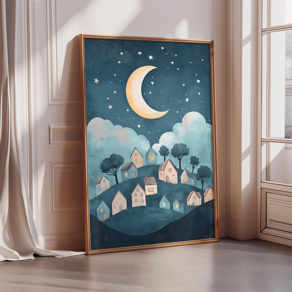 a framed illustration of a nighttime village scene with a crescent moon and stars in the sky.