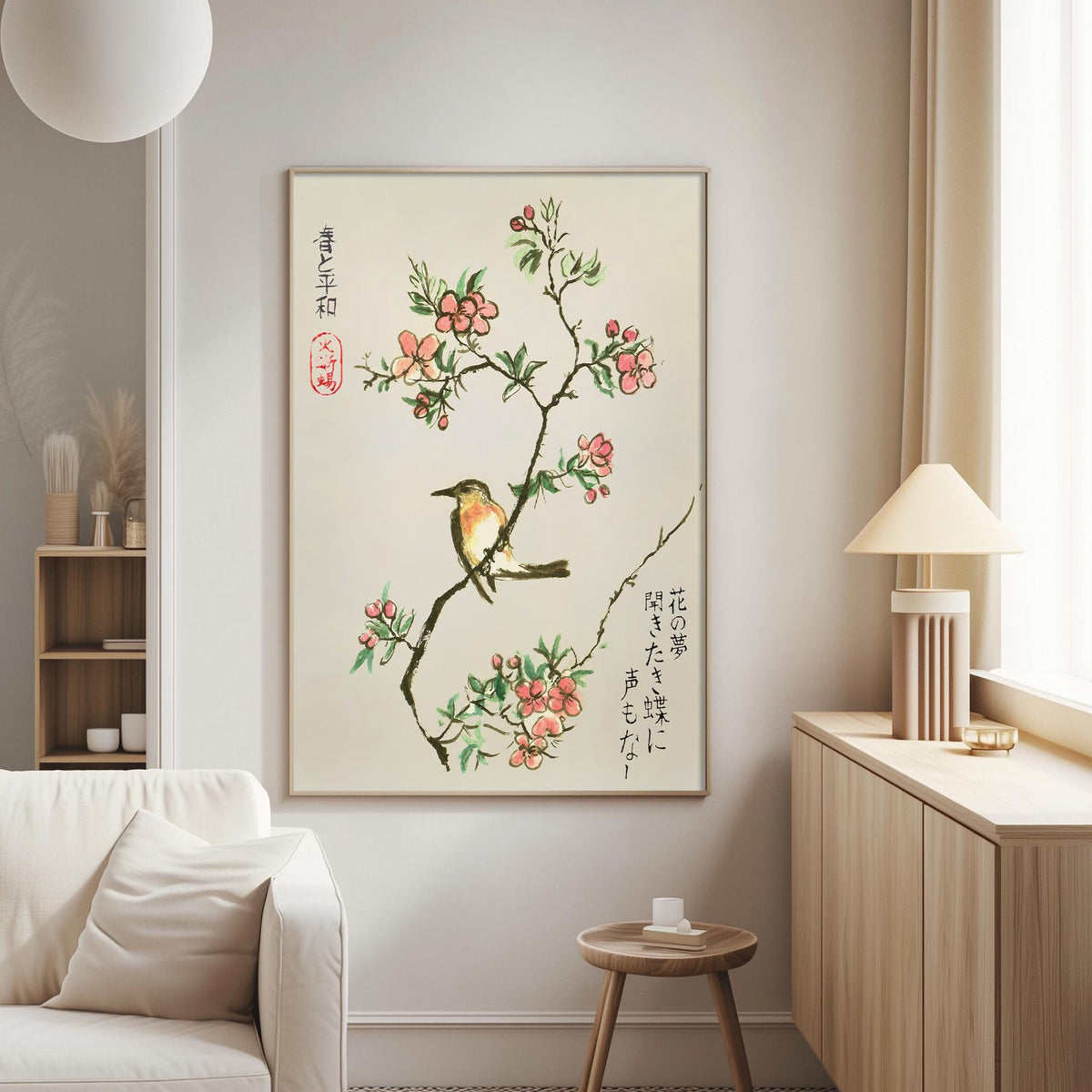 a living room with a large framed painting of a bird perched on a branch with pink flowers hanging on the wall. The painting is surrounded by various decorative items, including a lamp, a vase, and a bookshelf.