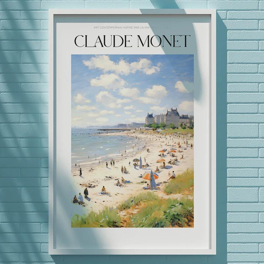 A framed painting of a beach scene hangs on a light blue wall, with a white light fixture above it.