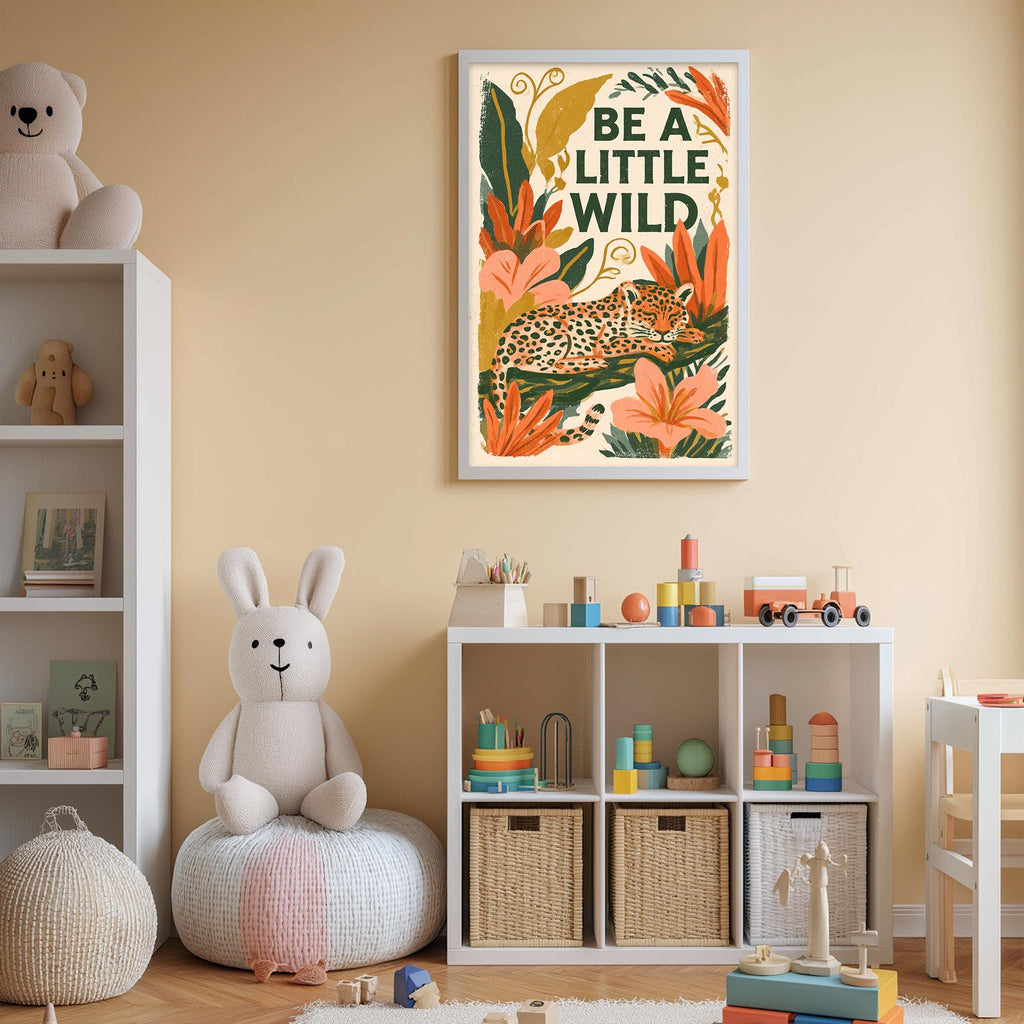 A child's bedroom with a white bookshelf, a stuffed rabbit, and a colorful poster on the wall. The poster features a leopard and the text "Be a little wild".