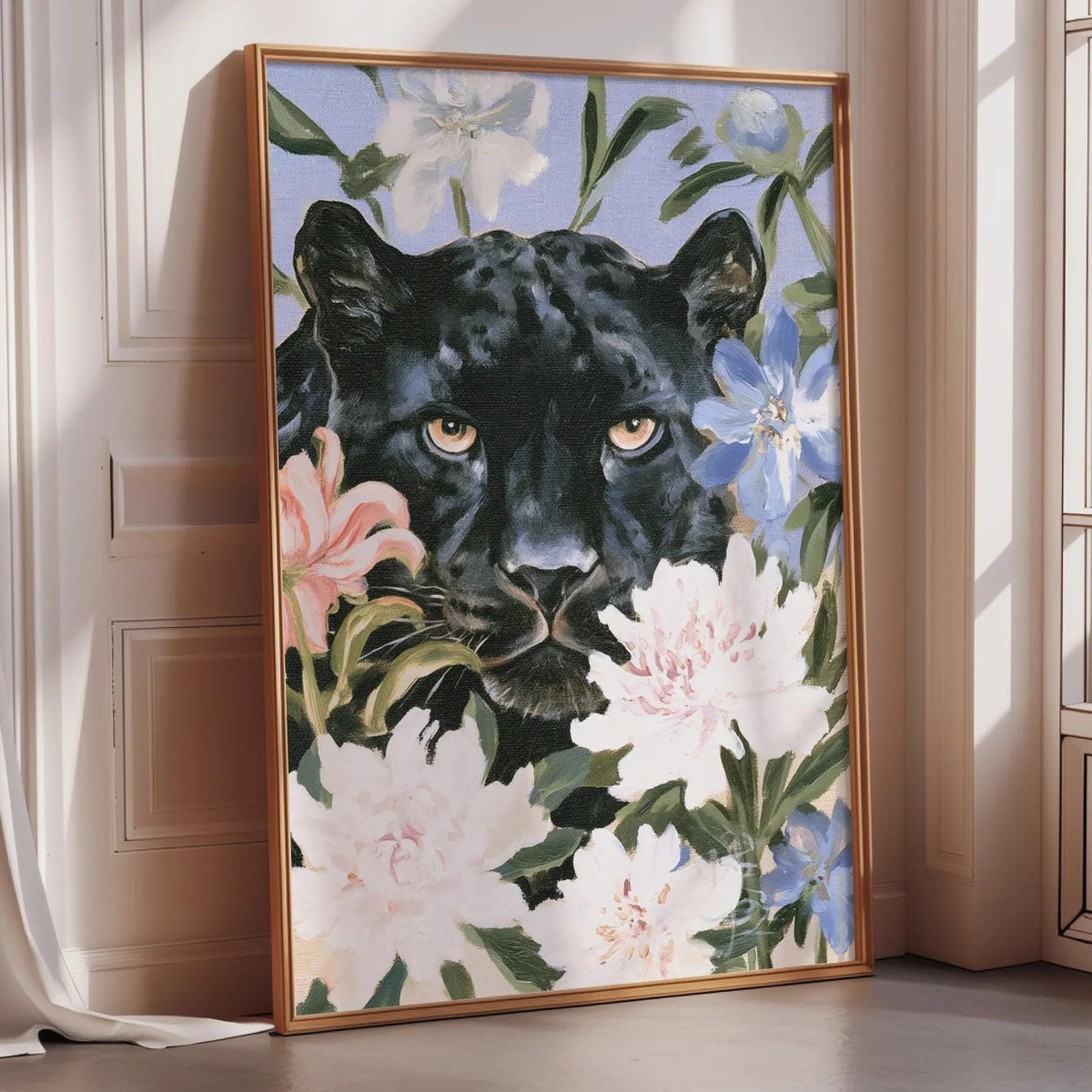 A framed painting of a black panther surrounded by colorful flowers is displayed on a wall in a room.