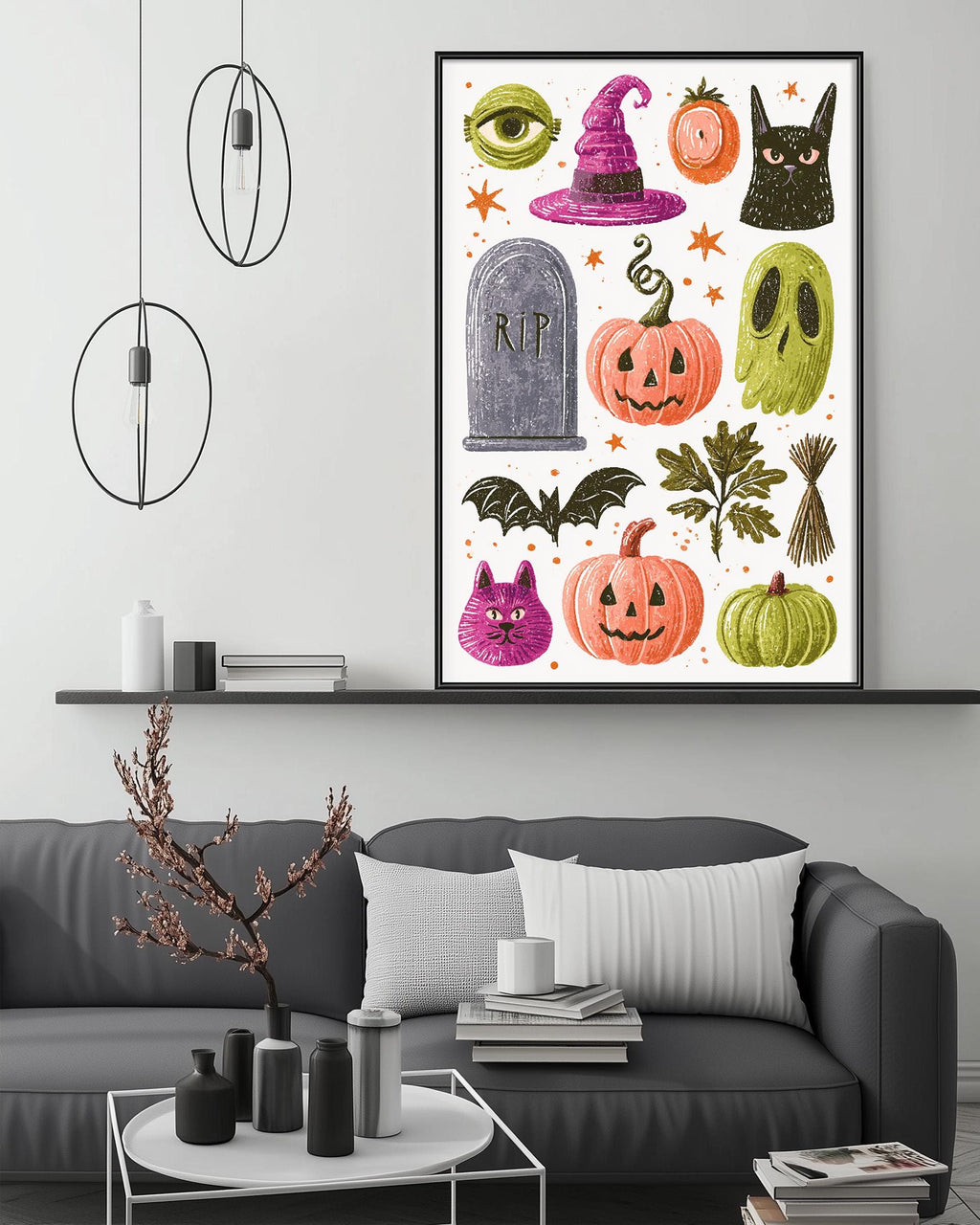 a living room with a gray couch, a coffee table, and a framed Halloween-themed poster on the wall above the couch.
