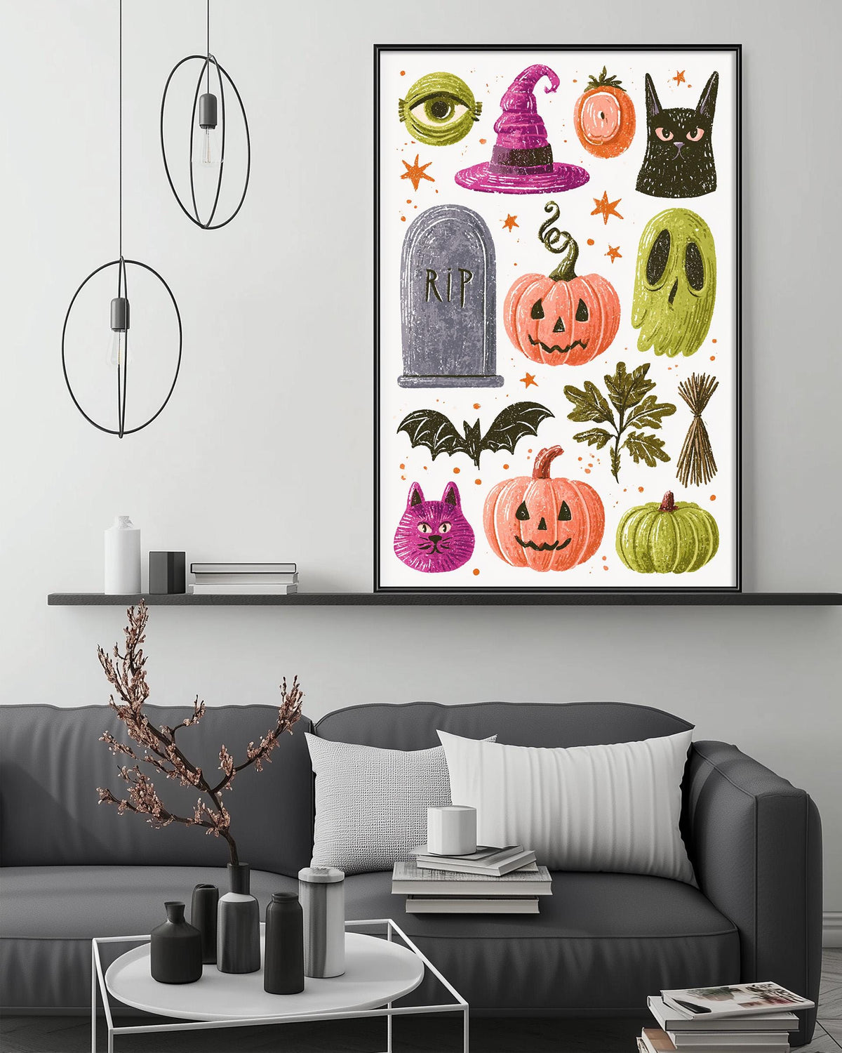a living room with a gray couch, a coffee table, and a framed Halloween-themed poster on the wall above the couch.
