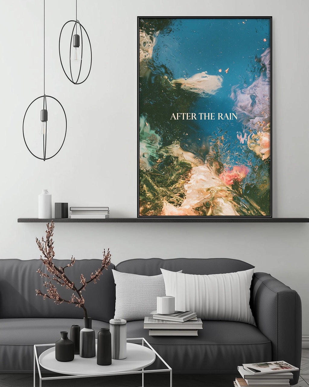 a modern living room with a gray sofa, a coffee table, and a large abstract painting hanging on the wall above the sofa.