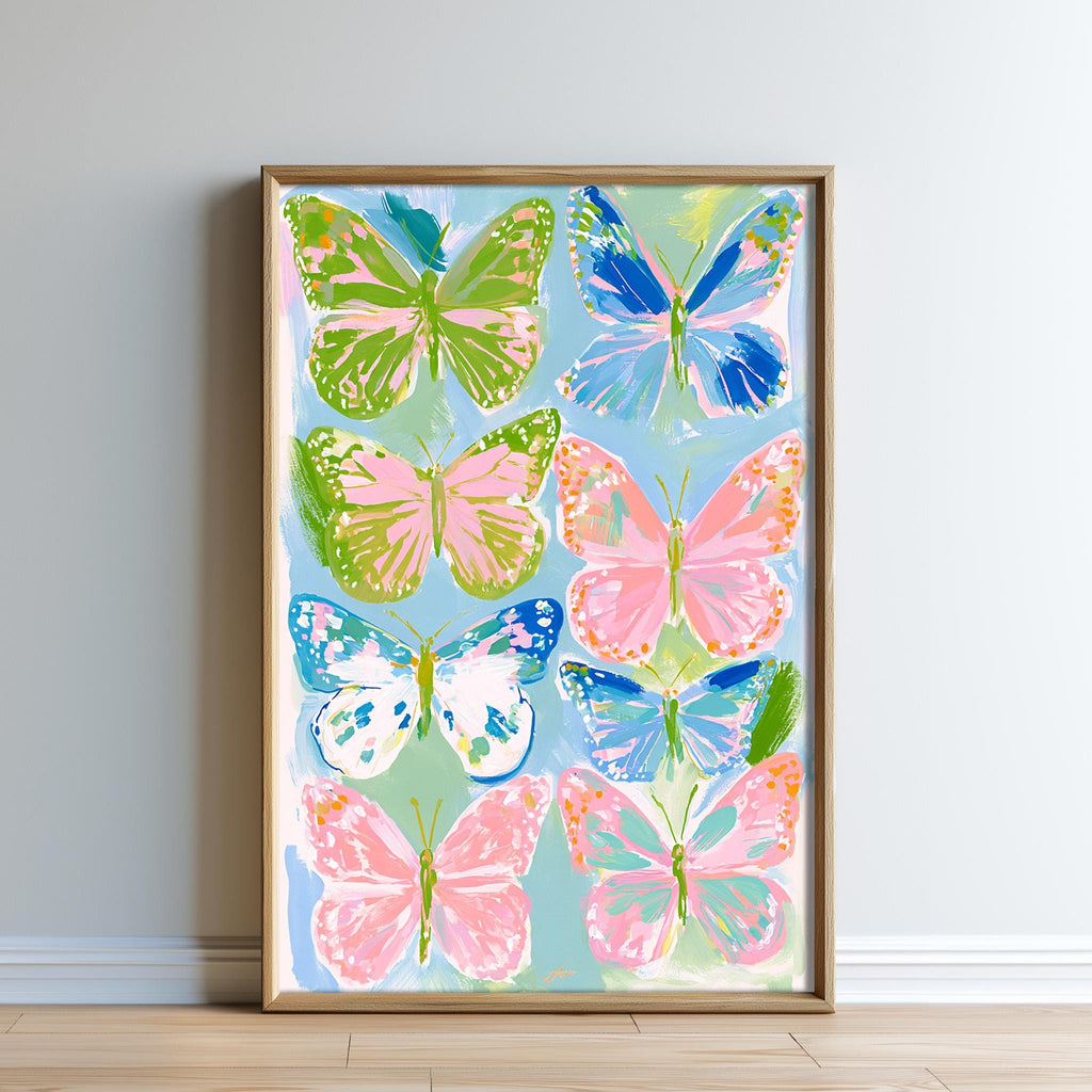The image is a framed painting of colorful butterflies, featuring various shades of green, pink, blue, and white.