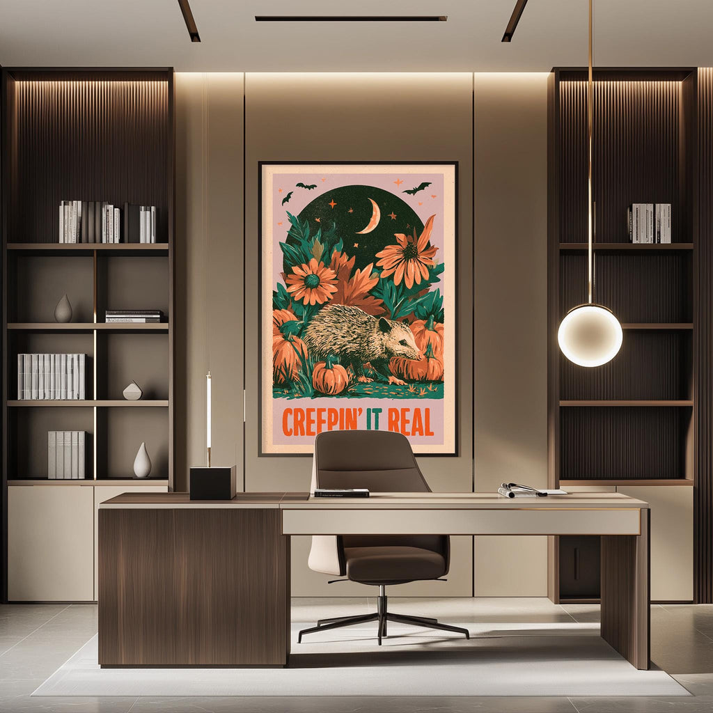 a modern office space with a desk, chair, and bookshelves. A framed poster with a hedgehog and flowers hangs on the wall above the desk.