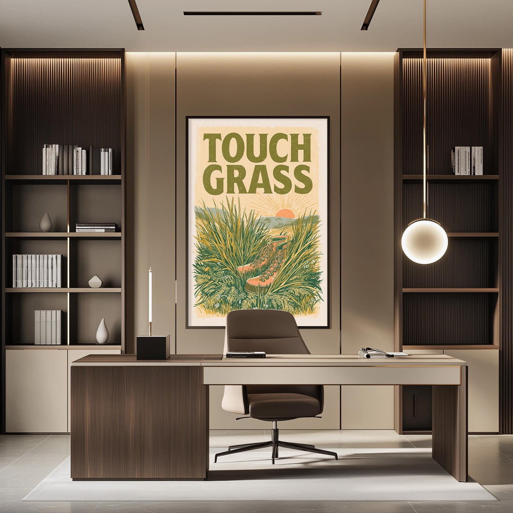 a modern office space with a large framed poster of a plant on the wall, a wooden desk with a chair, and built-in bookshelves.