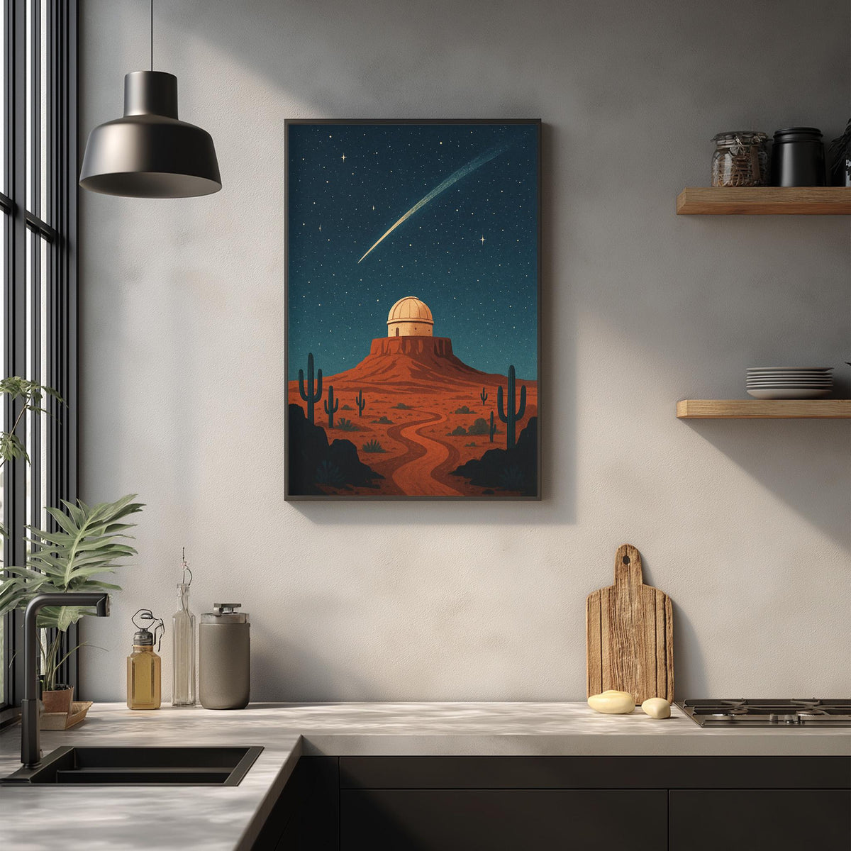 a framed illustration of a desert landscape with a crescent moon and a shooting star, hanging on a wall above a kitchen counter with various kitchen items and decor.