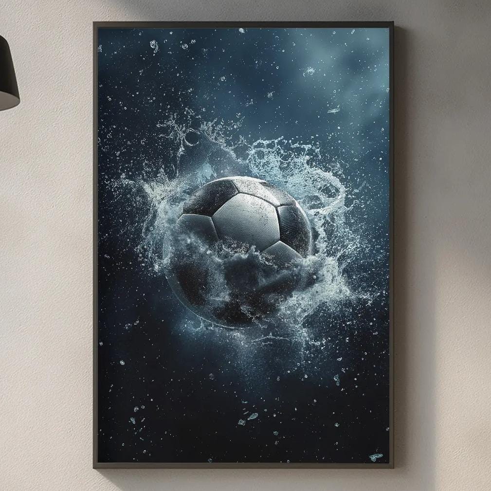a kitchen counter with various kitchen items, including a cutting board, a bottle, and a vase. Above the counter, there is a framed image of a soccer ball surrounded by water, creating a dynamic and artistic scene.