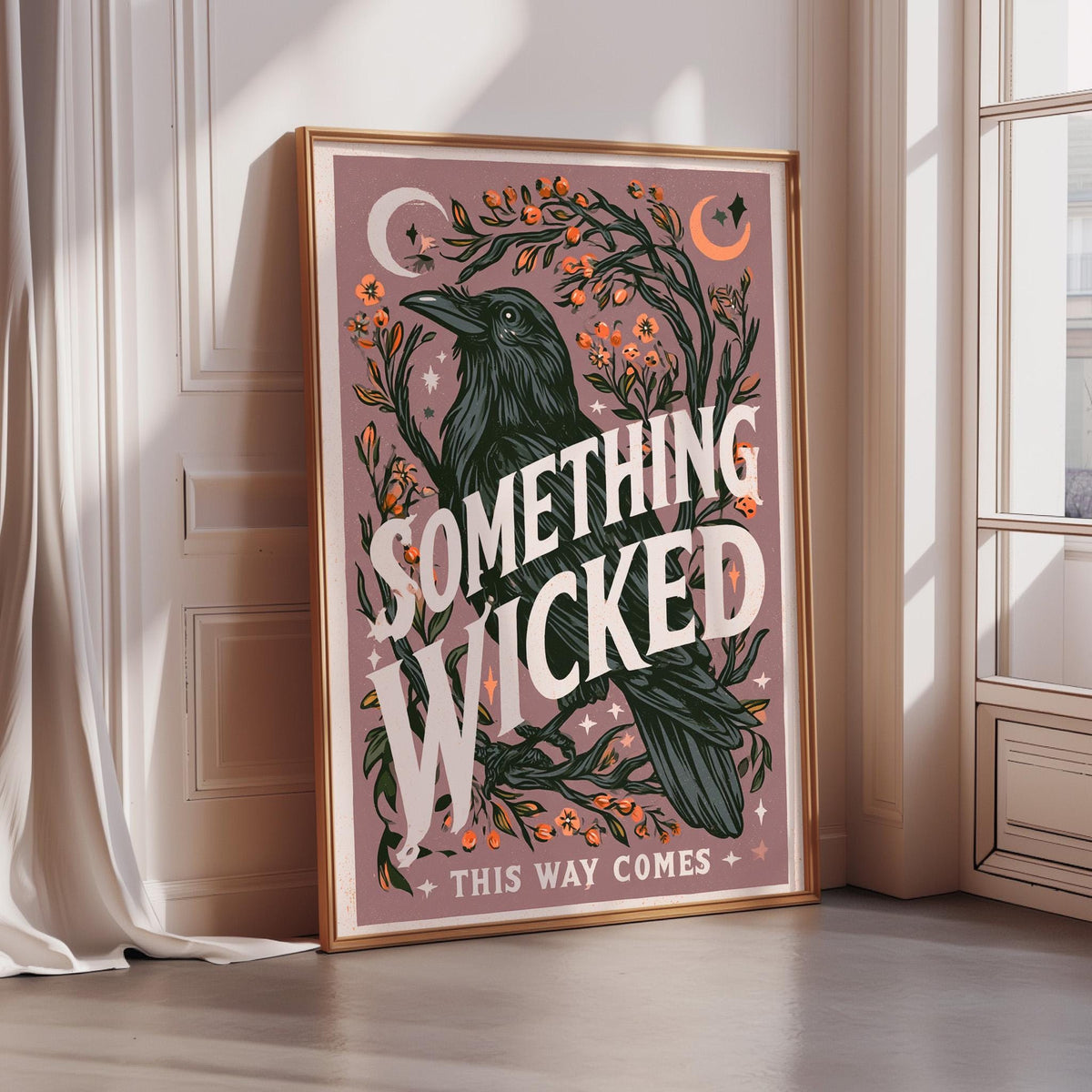 a framed poster with a black bird and a floral design, along with the text "Something Wicked This Way Comes" and "THIS WAY COMES".