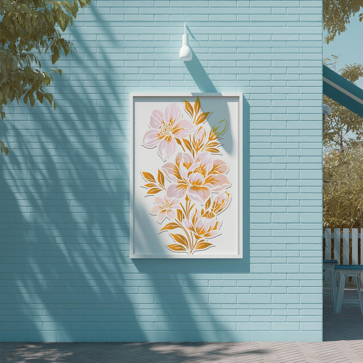 a blue brick wall with a framed artwork of pink and yellow flowers hanging on it.